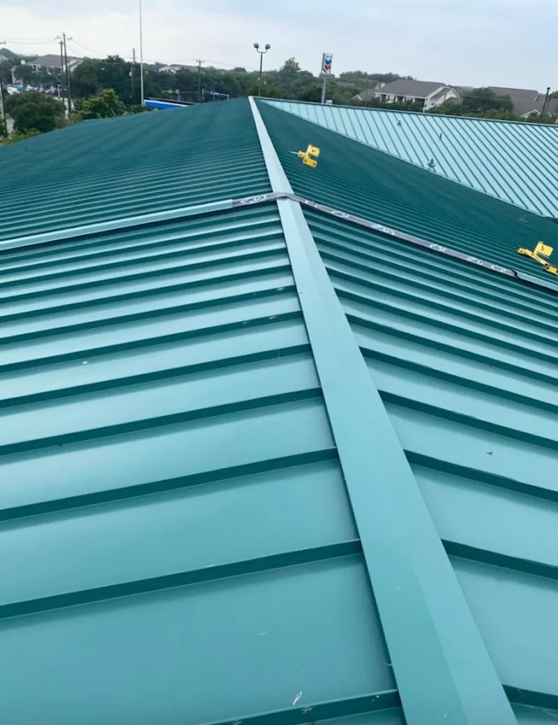 Green commercial metal roof ridge and valley for Metal Roof Repair in Rockdale