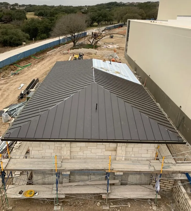 Metal roof new construction with scaffolding in Rockdale